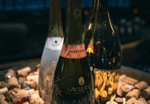Three champagne bottles surrounded by corks